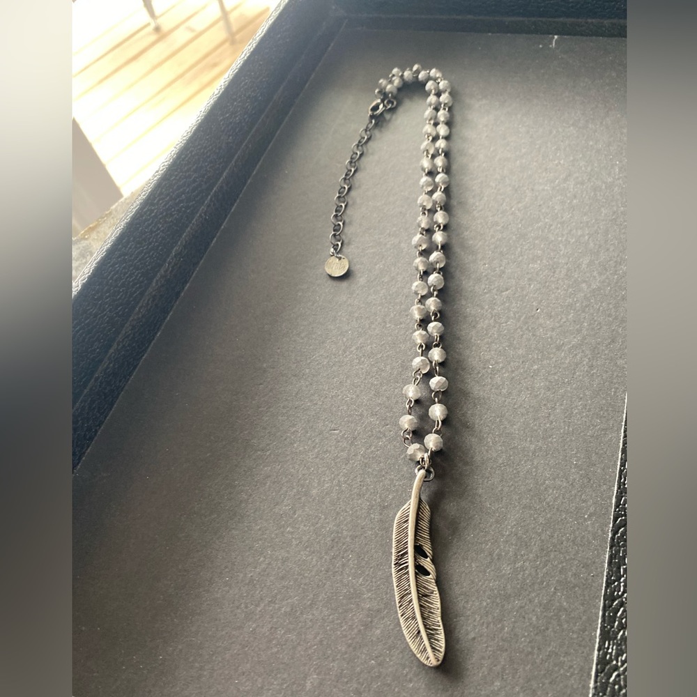 Silver toned beaded bracelet with feather 🪶 charm